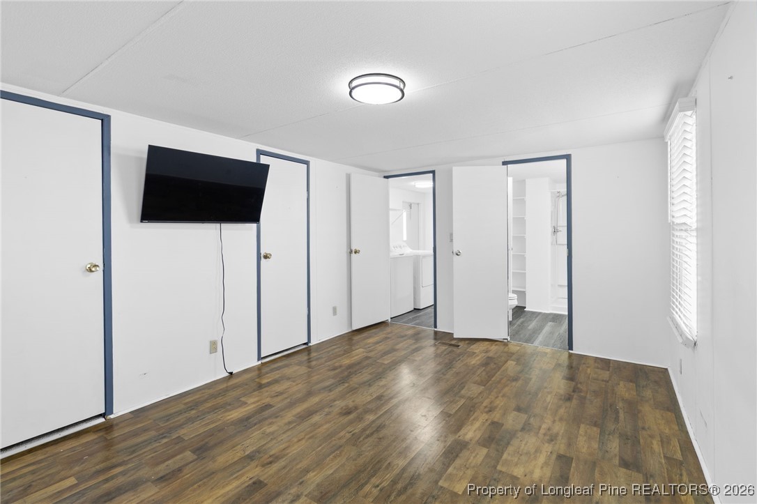 7321 Sheriff Watson Road Sanford, NC 27332 - Photo 15 of 26 a view of an empty room with wooden floor and a window