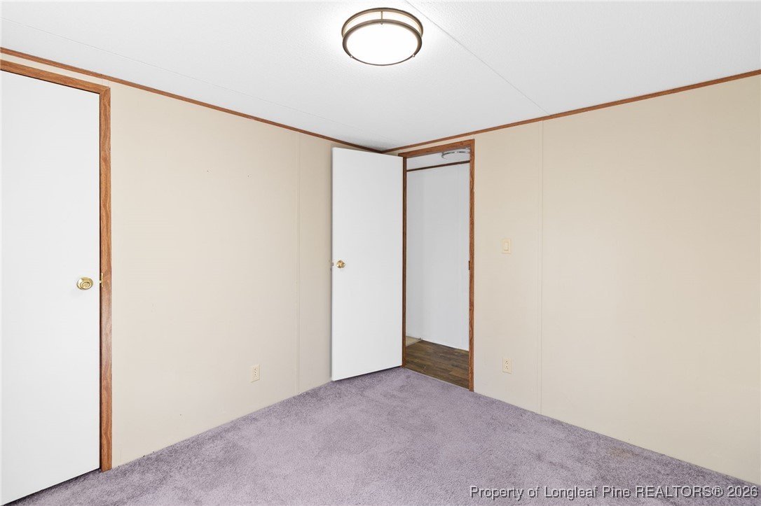 7321 Sheriff Watson Road Sanford, NC 27332 - Photo 18 of 26 a view of a room with wooden floor