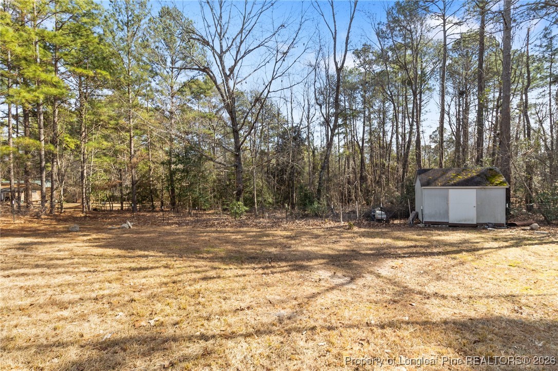 7321 Sheriff Watson Road Sanford, NC 27332 - Photo 26 of 26 a view of a yard with trees