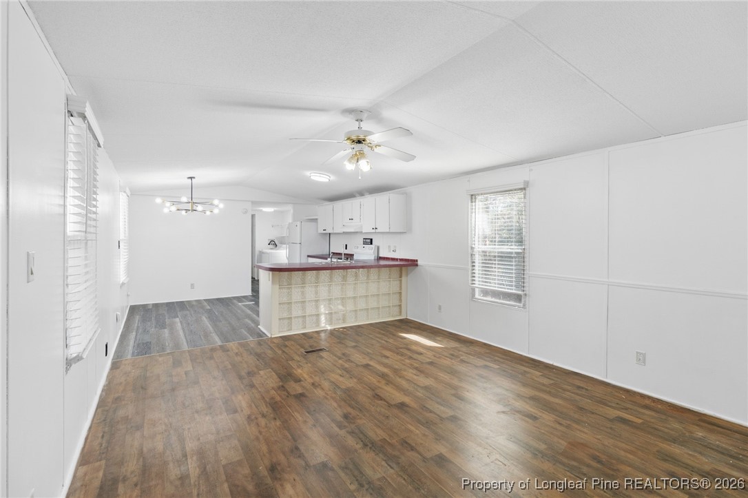 7321 Sheriff Watson Road Sanford, NC 27332 - Photo 4 of 26 a view of kitchen with wooden floor and window