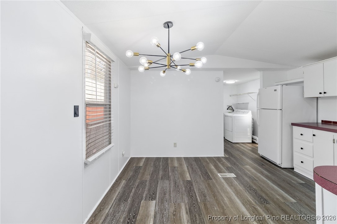 7321 Sheriff Watson Road Sanford, NC 27332 - Photo 7 of 26 wooden floor in an empty room with a window