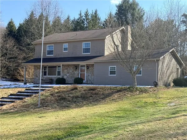 a view of a house with a swimming pool