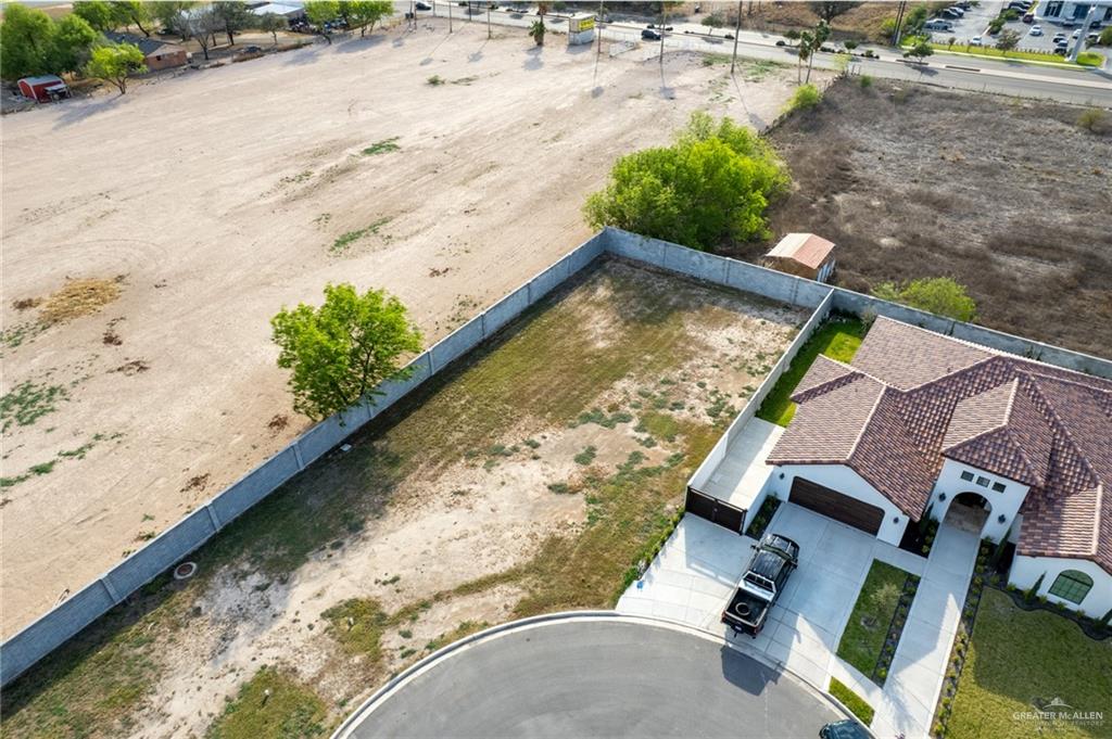 8801 9th Street McAllen, TX 78504 - Photo 3 of 10 an aerial view of a house with a yard and lake view