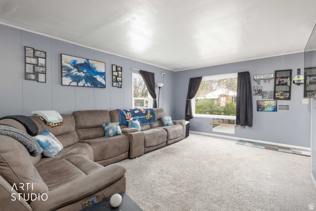 875 Patterson Street Ogden, UT 84403 - Photo 7 of 38 Carpeted living area with a decorative wall and baseboards