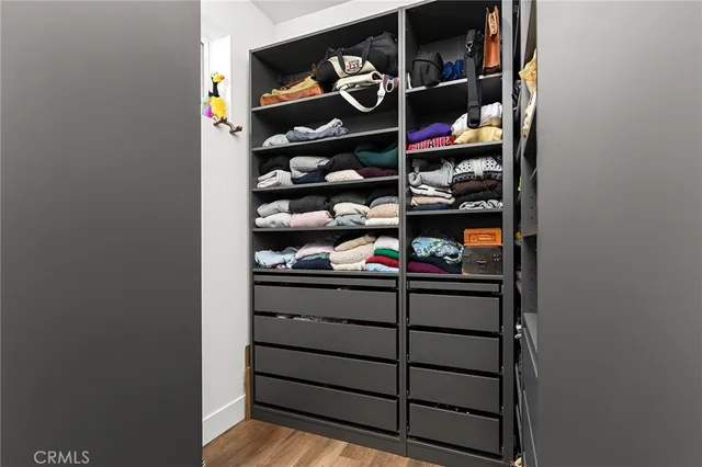 a room with a wine shelf