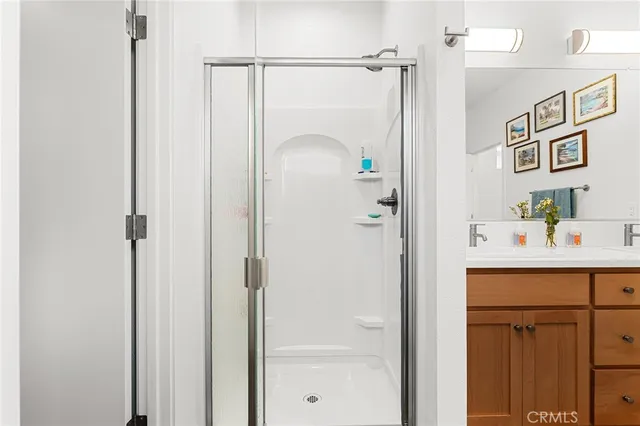 a bathroom with a shower and a sink