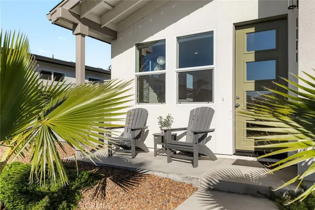 a view of a chairs and table in a patio