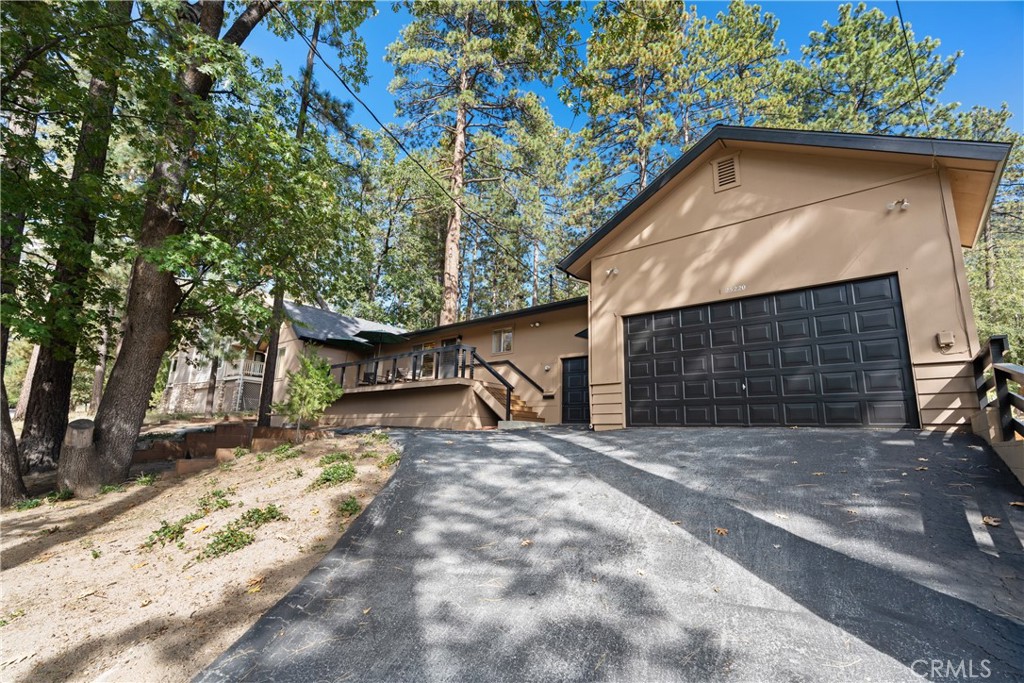 25220 Rim Rock Road Idyllwild, CA 92549 - Photo 1 of 55 a view of a house with a yard