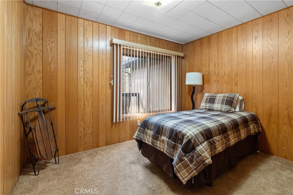 25220 Rim Rock Road Idyllwild, CA 92549 - Photo 22 of 55 a bedroom with a bed and a window