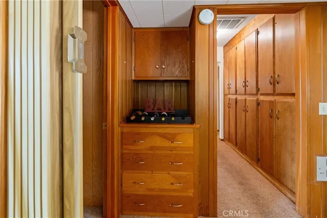 a living room with furniture a flat screen tv and a table