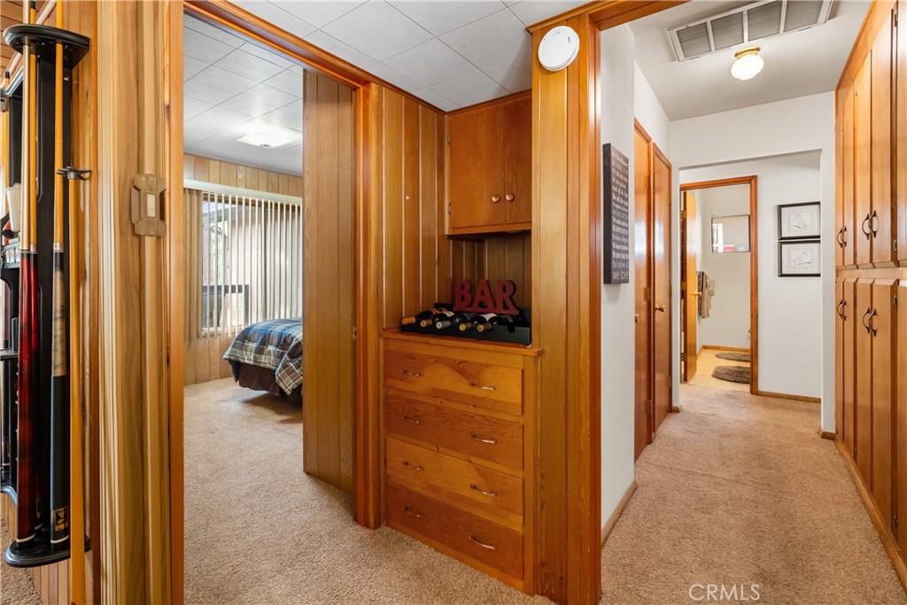 25220 Rim Rock Road Idyllwild, CA 92549 - Photo 24 of 55 a view of a hallway with closet and a livingroom view