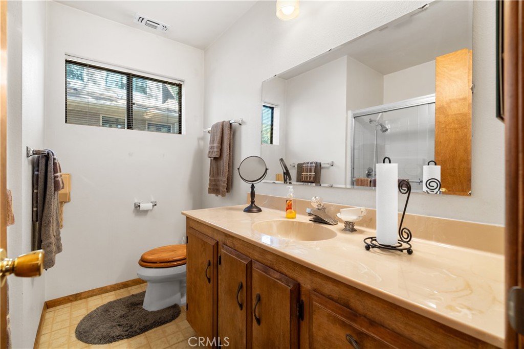 25220 Rim Rock Road Idyllwild, CA 92549 - Photo 29 of 55 a bathroom with a sink and a mirror