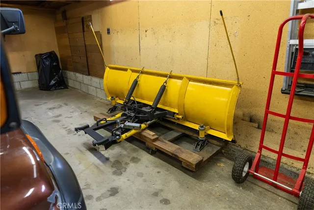 a view of balcony with chairs and wooden fence