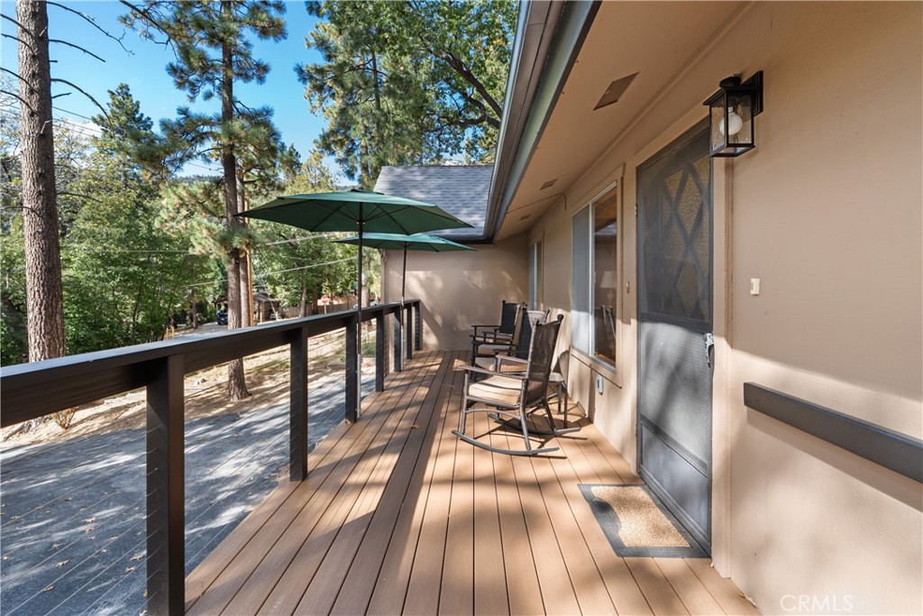 25220 Rim Rock Road Idyllwild, CA 92549 - Photo 45 of 55 a view of balcony with chairs and wooden fence