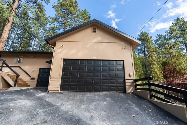 a view of a room with gym equipment and a large window