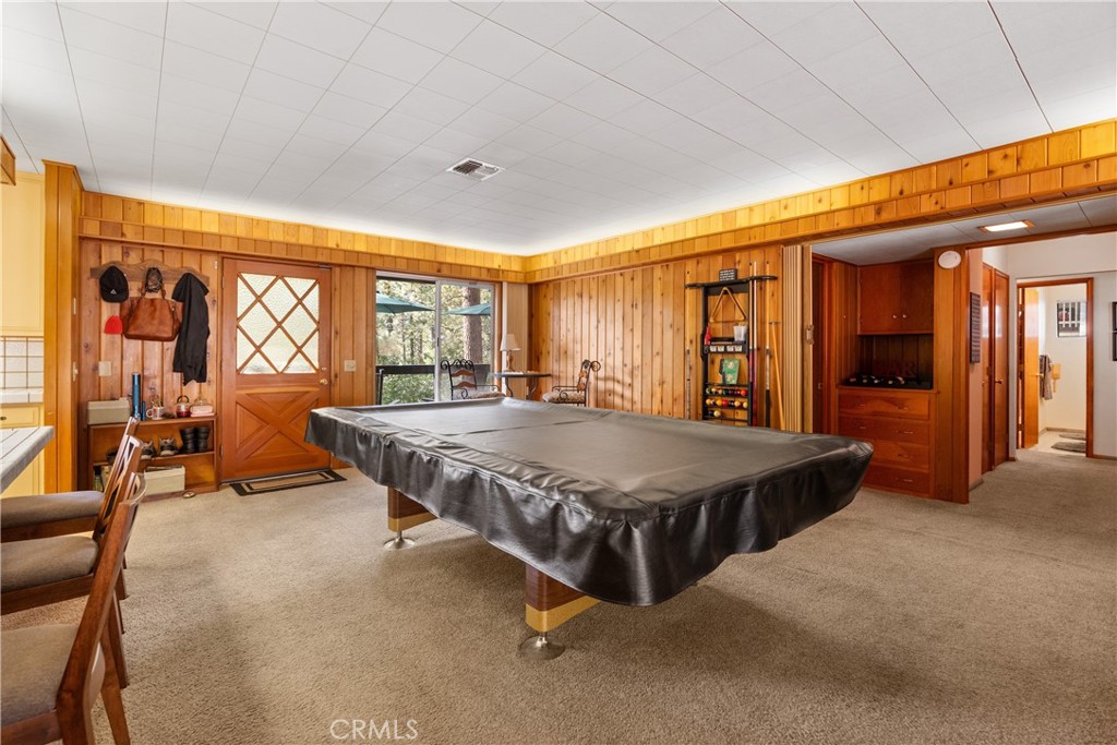25220 Rim Rock Road Idyllwild, CA 92549 - Photo 8 of 55 a spacious bedroom with a large bed and a large window