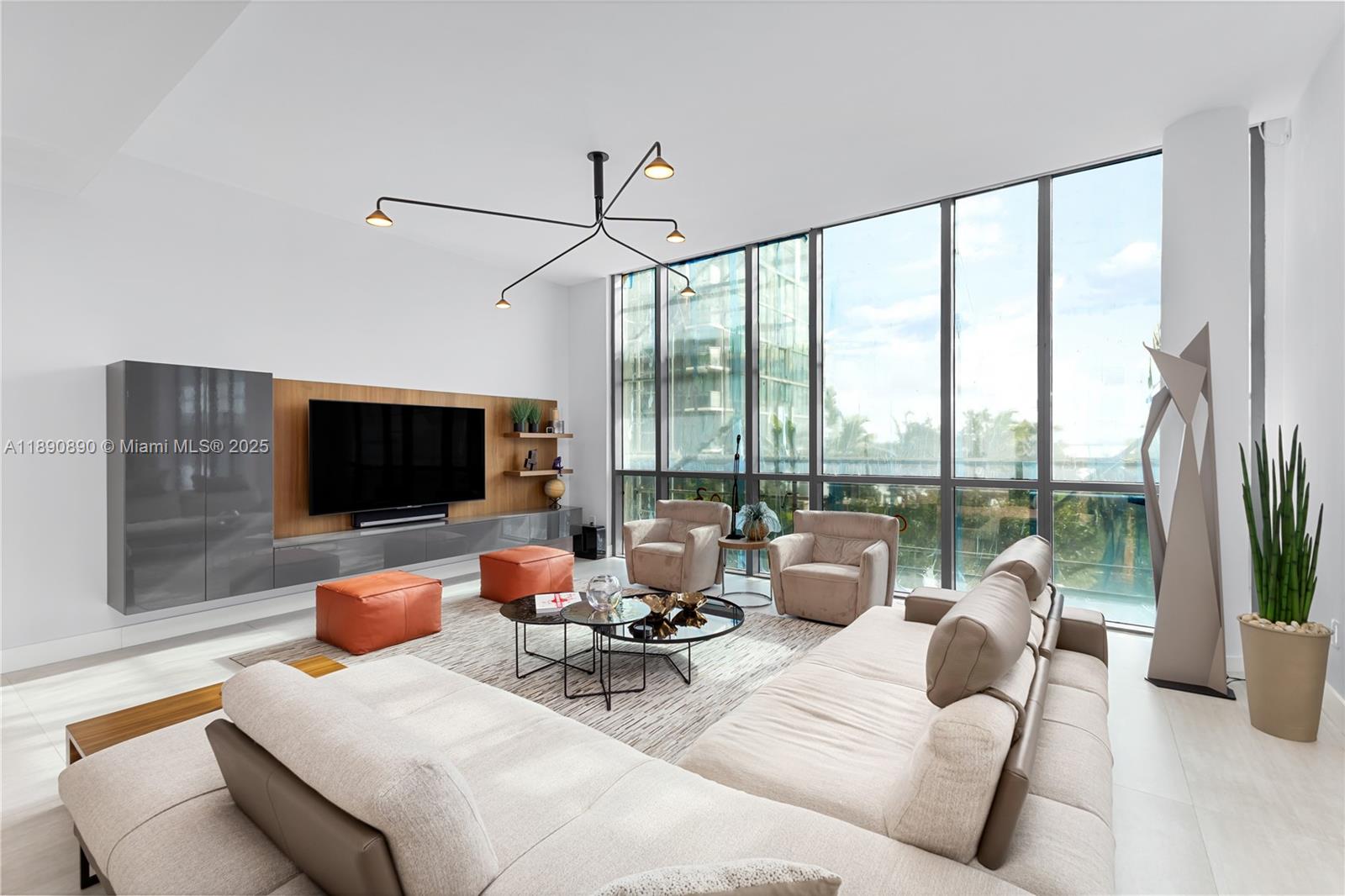 650 Northeast 32nd Street, Unit BH7 Miami, FL 33137 - Photo 4 of 53 a living room with furniture and a flat screen tv