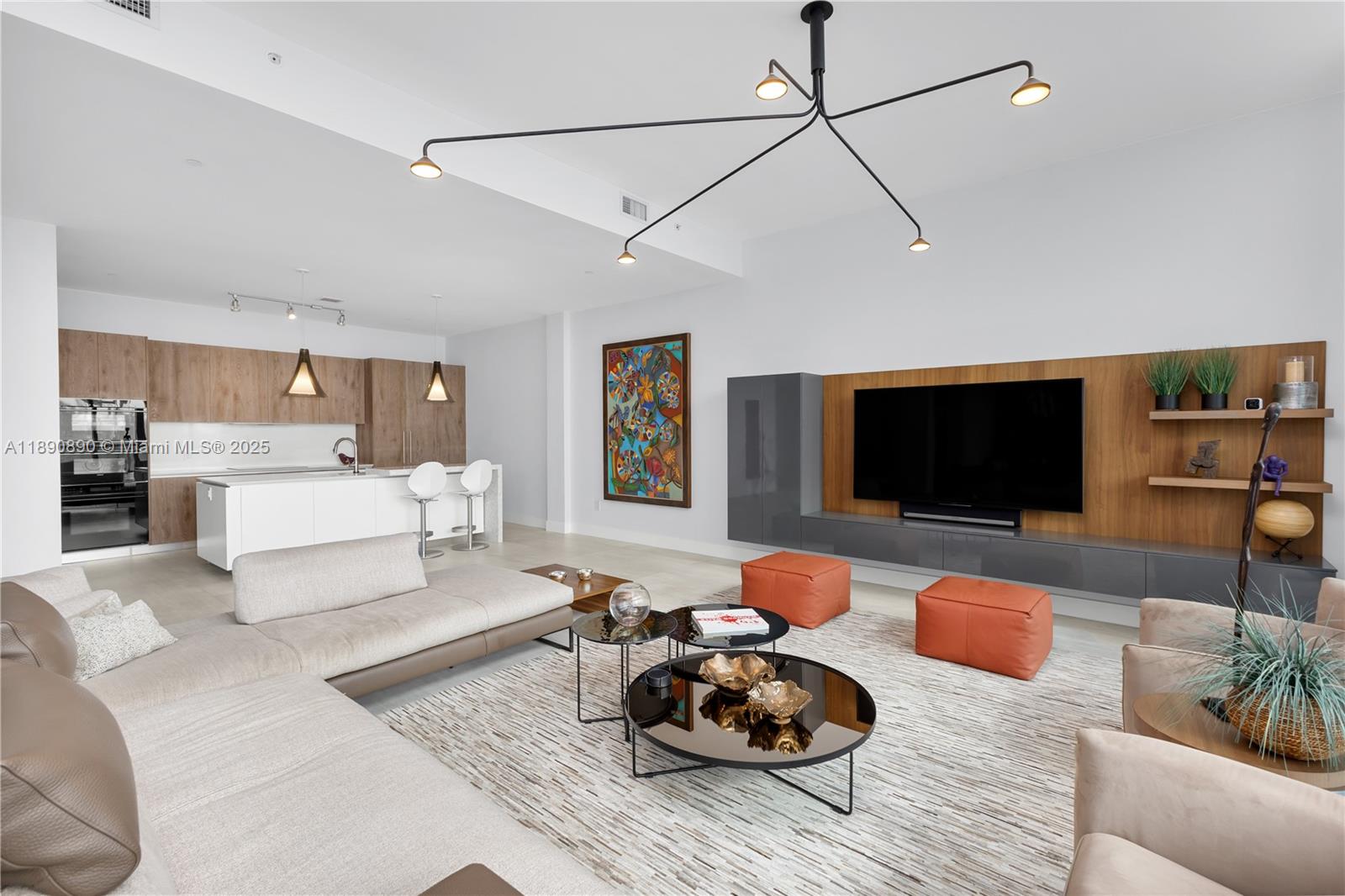 650 Northeast 32nd Street, Unit BH7 Miami, FL 33137 - Photo 47 of 53 a living room with furniture and a flat screen tv