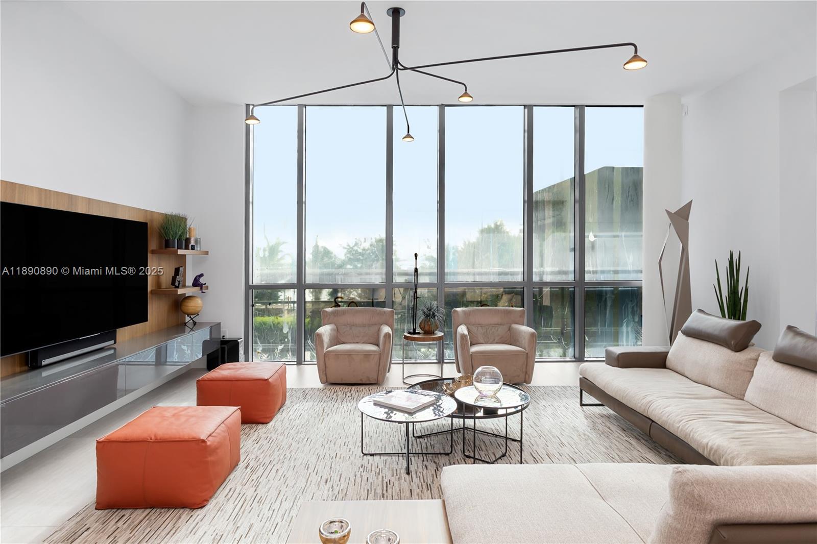 650 Northeast 32nd Street, Unit BH7 Miami, FL 33137 - Photo 48 of 53 a living room with furniture and a flat screen tv