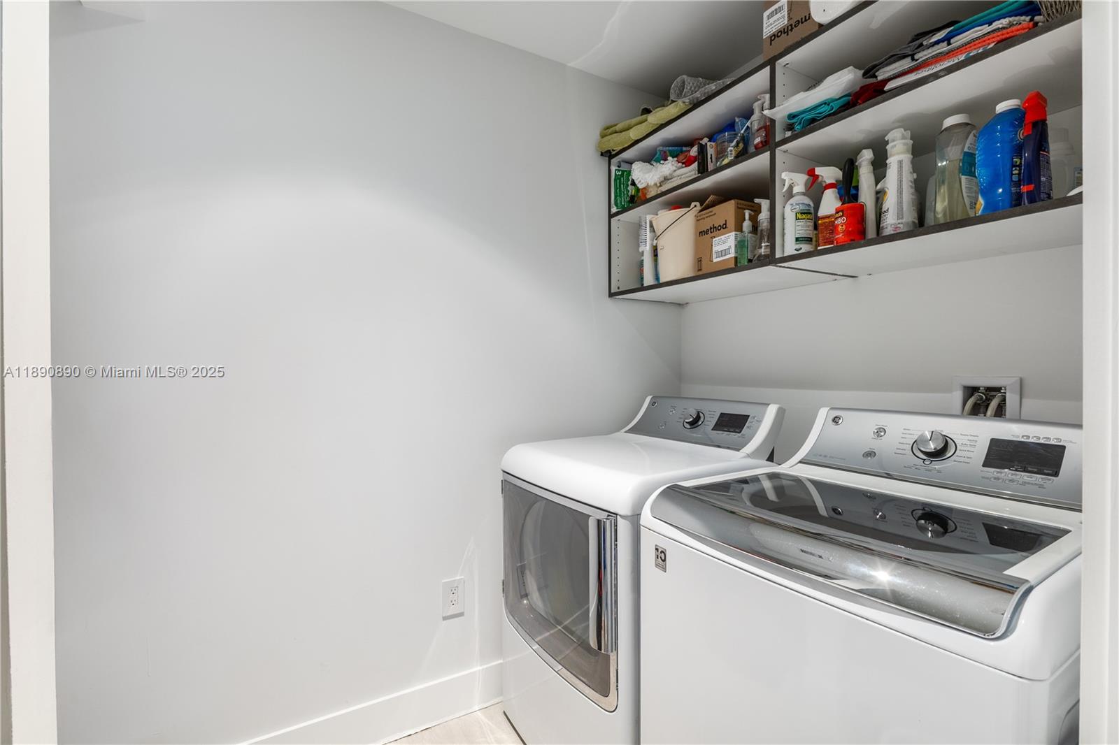 650 Northeast 32nd Street, Unit BH7 Miami, FL 33137 - Photo 53 of 53 a utility room with dryer and washer