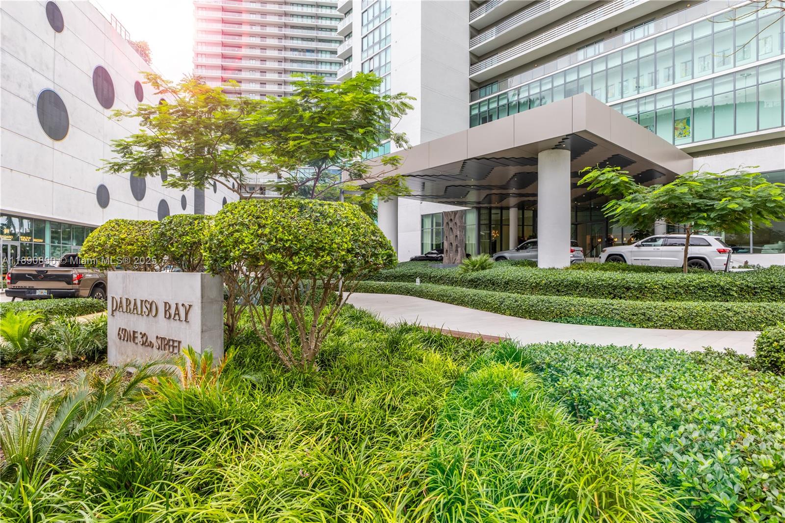 650 Northeast 32nd Street, Unit BH7 Miami, FL 33137 - Photo 8 of 53 a front view of a building with garden