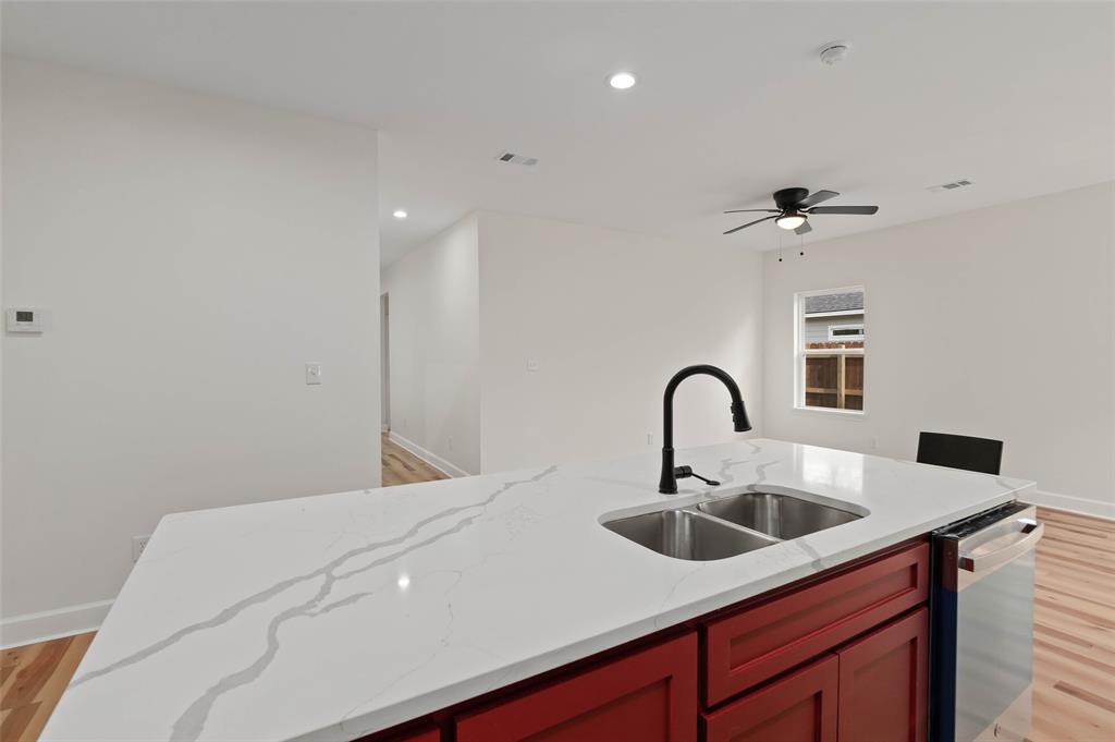 1520 Harris Street Gainesville, TX 76240 - Photo 16 of 24 a bathroom with a sink and a bathtub