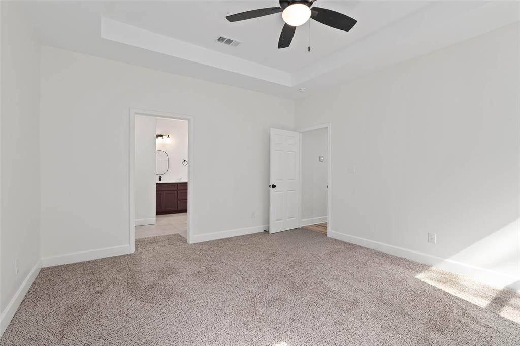 1520 Harris Street Gainesville, TX 76240 - Photo 18 of 24 an empty room with chandelier fan