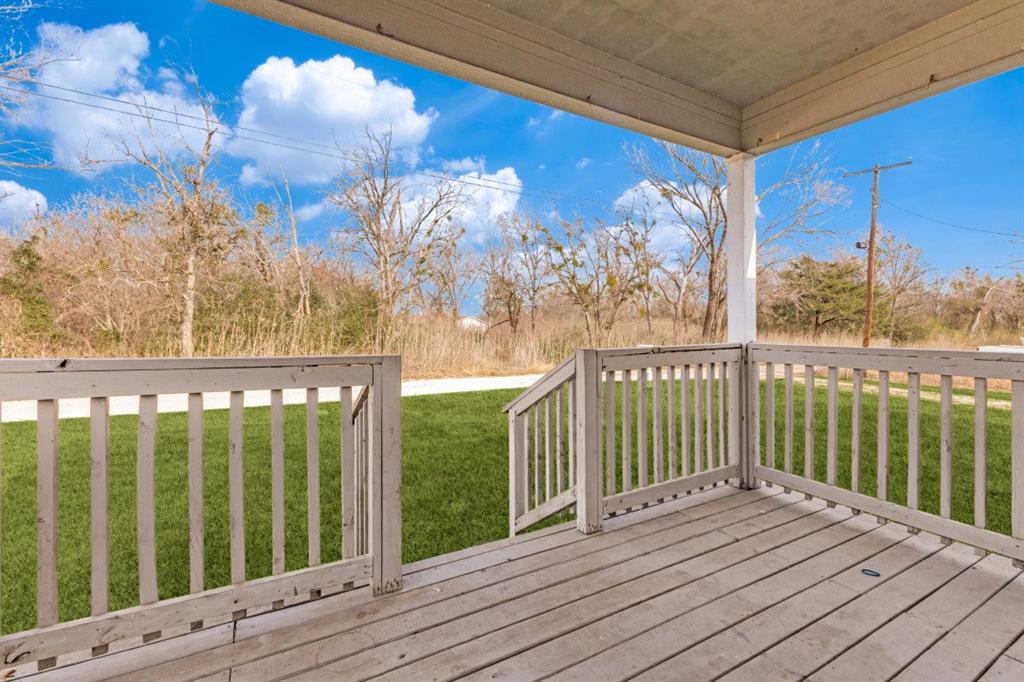 711 South 3rd Avenue East Dawson, TX 76639 - Photo 2 of 12 a view of balcony with wooden floor