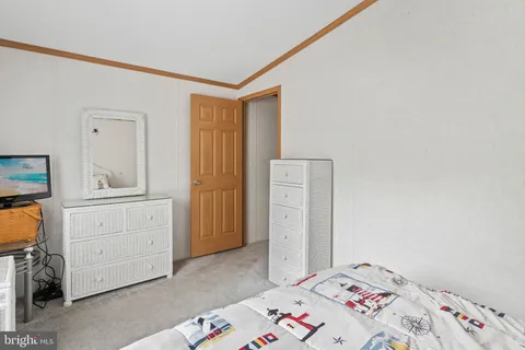 a bedroom with a bed and utility room