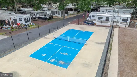a view of a swimming pool with seating area