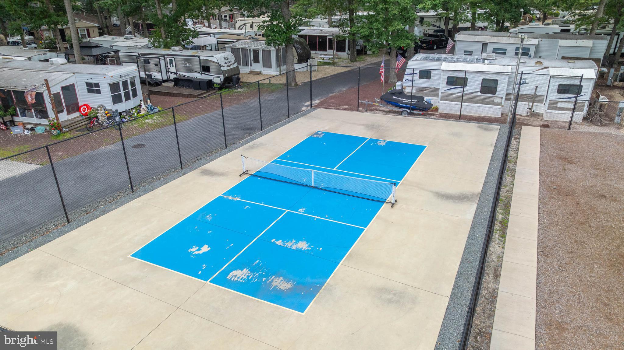 25754 Blue Ridge Street Millsboro, DE 19966 - Photo 27 of 32 a view of a swimming pool with seating area