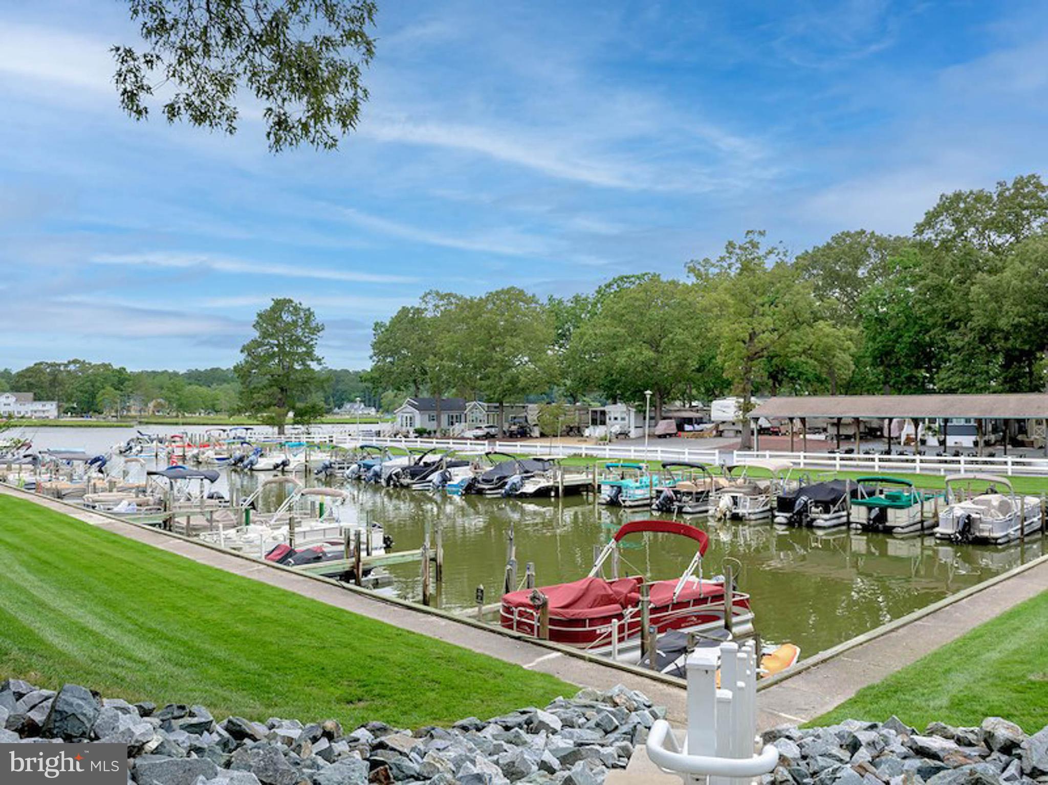 25754 Blue Ridge Street Millsboro, DE 19966 - Photo 32 of 32 a view of a lake with a city