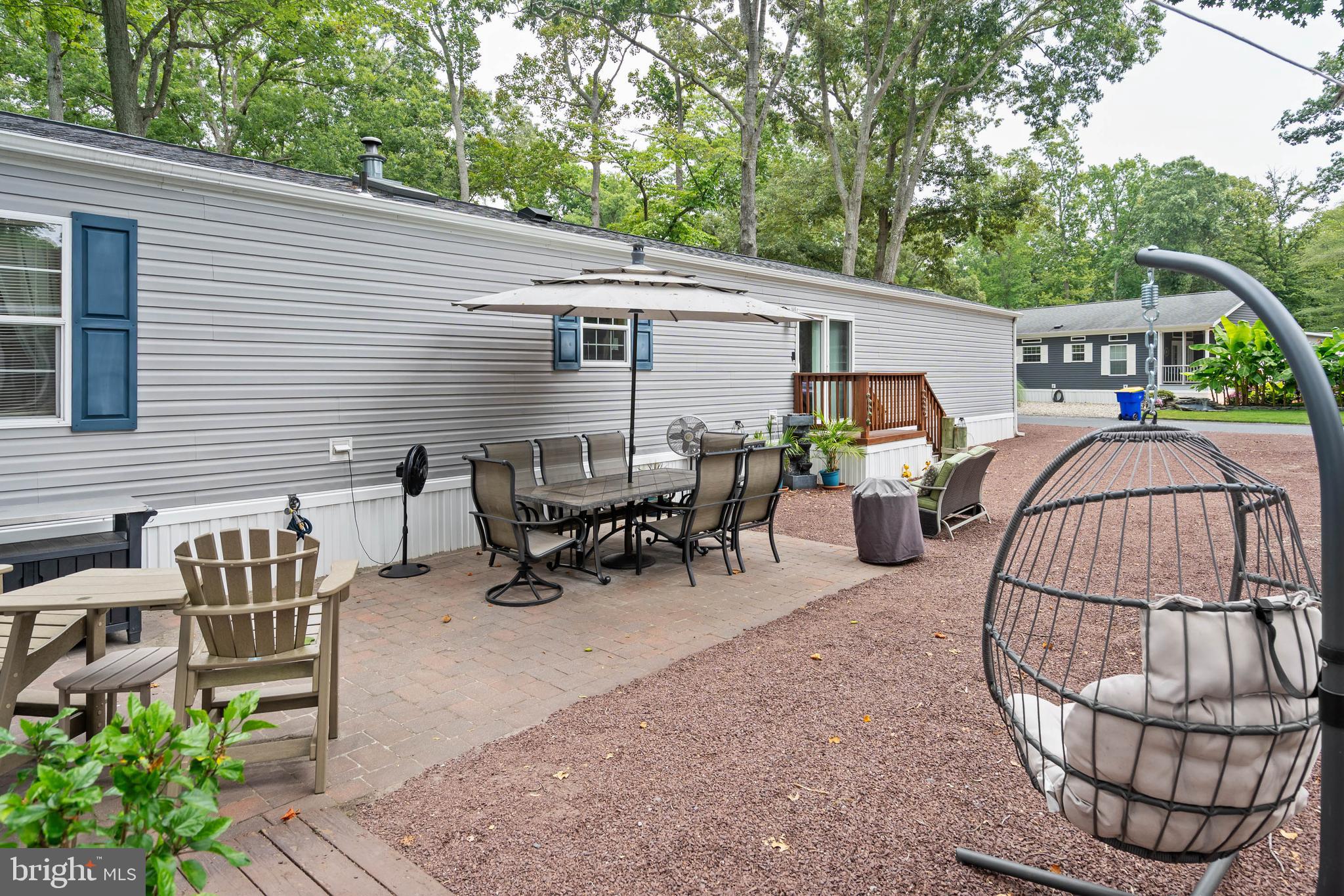 25754 Blue Ridge Street Millsboro, DE 19966 - Photo 4 of 32 a view of a dinning tables and chairs in the patio