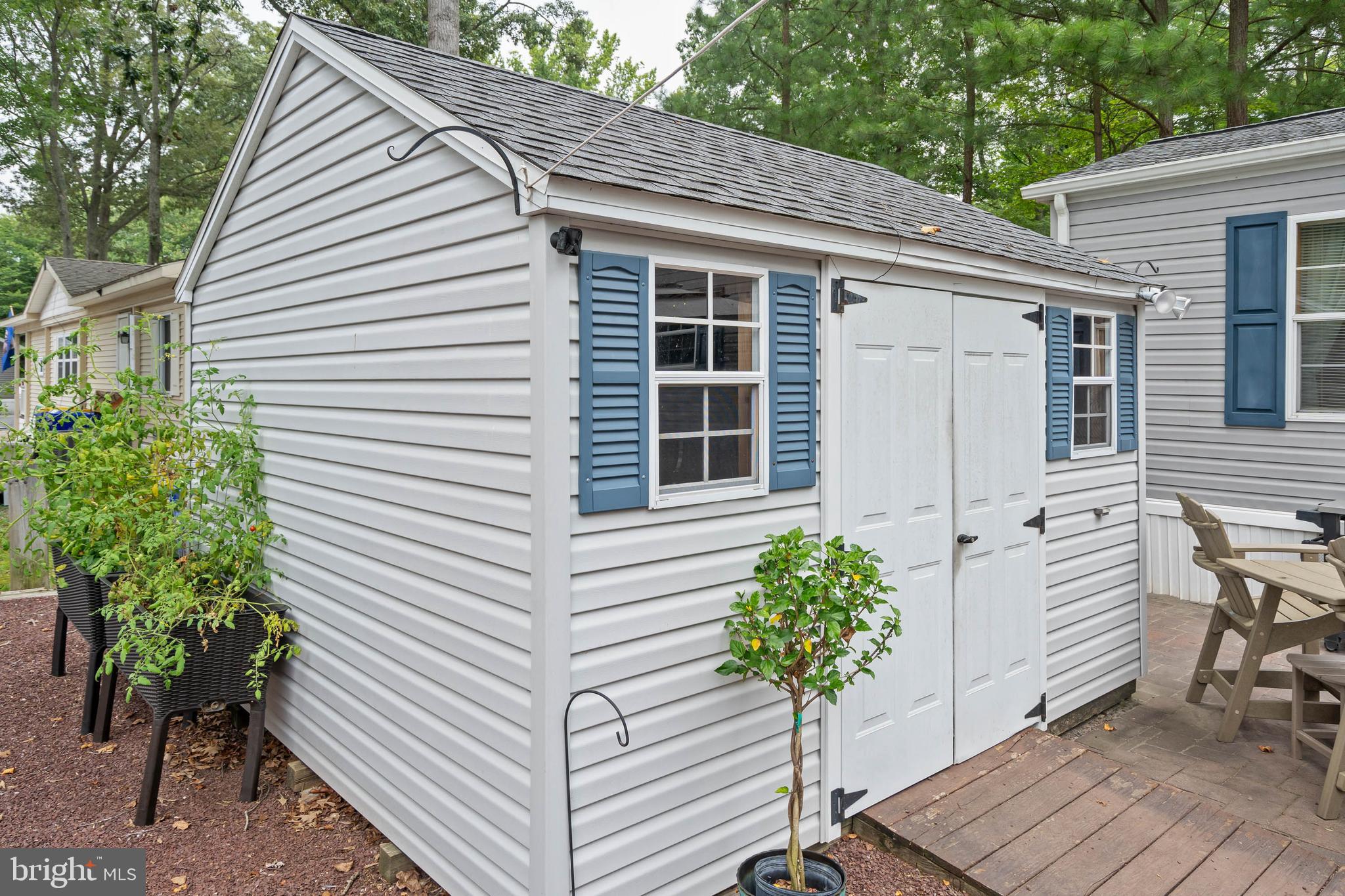 25754 Blue Ridge Street Millsboro, DE 19966 - Photo 6 of 32 a front view of a house with patio