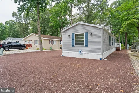 a view of front of house with a yard