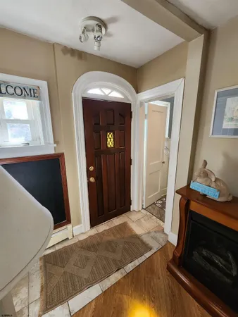 a bedroom with a bed and a mirror