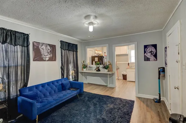 a living room with furniture and a rug
