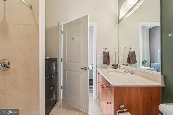a view of walk in closet with clothes