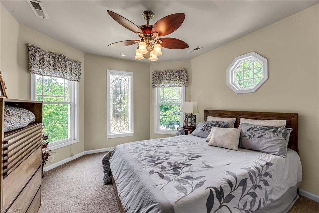 1724 Warf Road Lexington, NC 27292 - Photo 28 of 44 The leaded glass window has a shade for privacy and darkness.