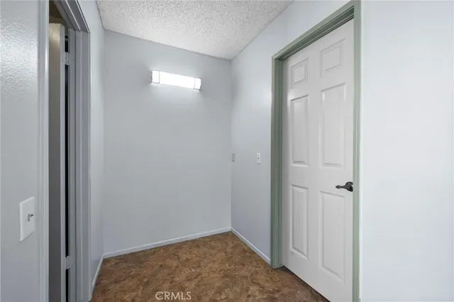 a view of hallway with closet