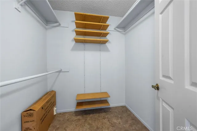 a room with a window and a ceiling fan