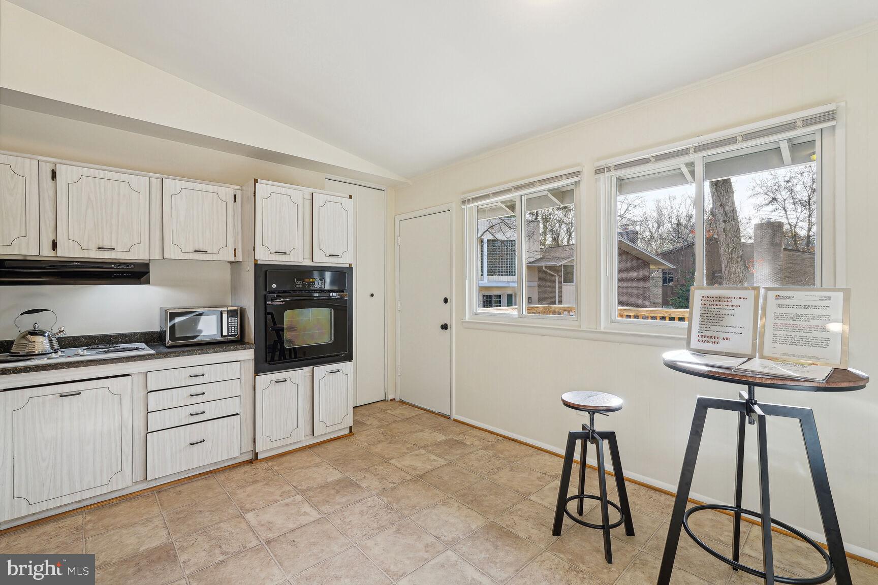 6420 Hollins Drive Bethesda, MD 20817 - Photo 12 of 34 Door to deck also from the kitchen