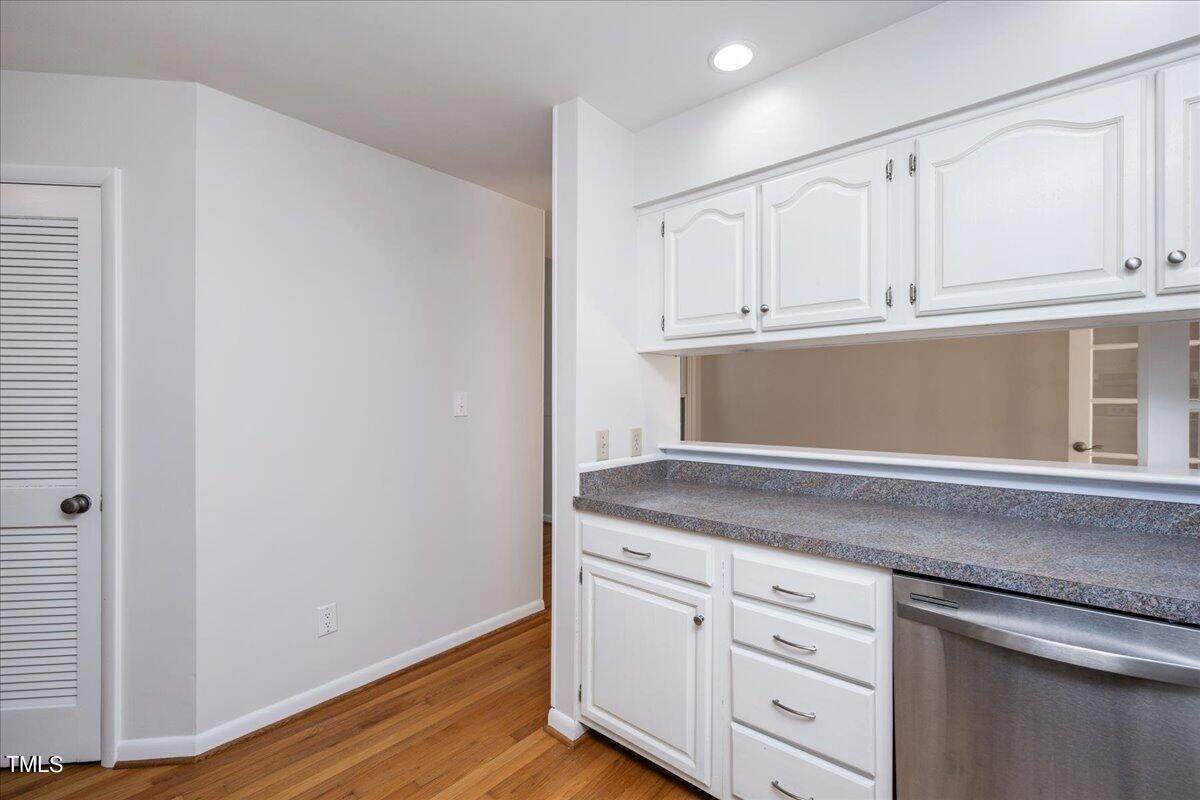 4201 Loon Lane Raleigh, NC 27616 - Photo 12 of 31 a kitchen with granite countertop white cabinets and a sink