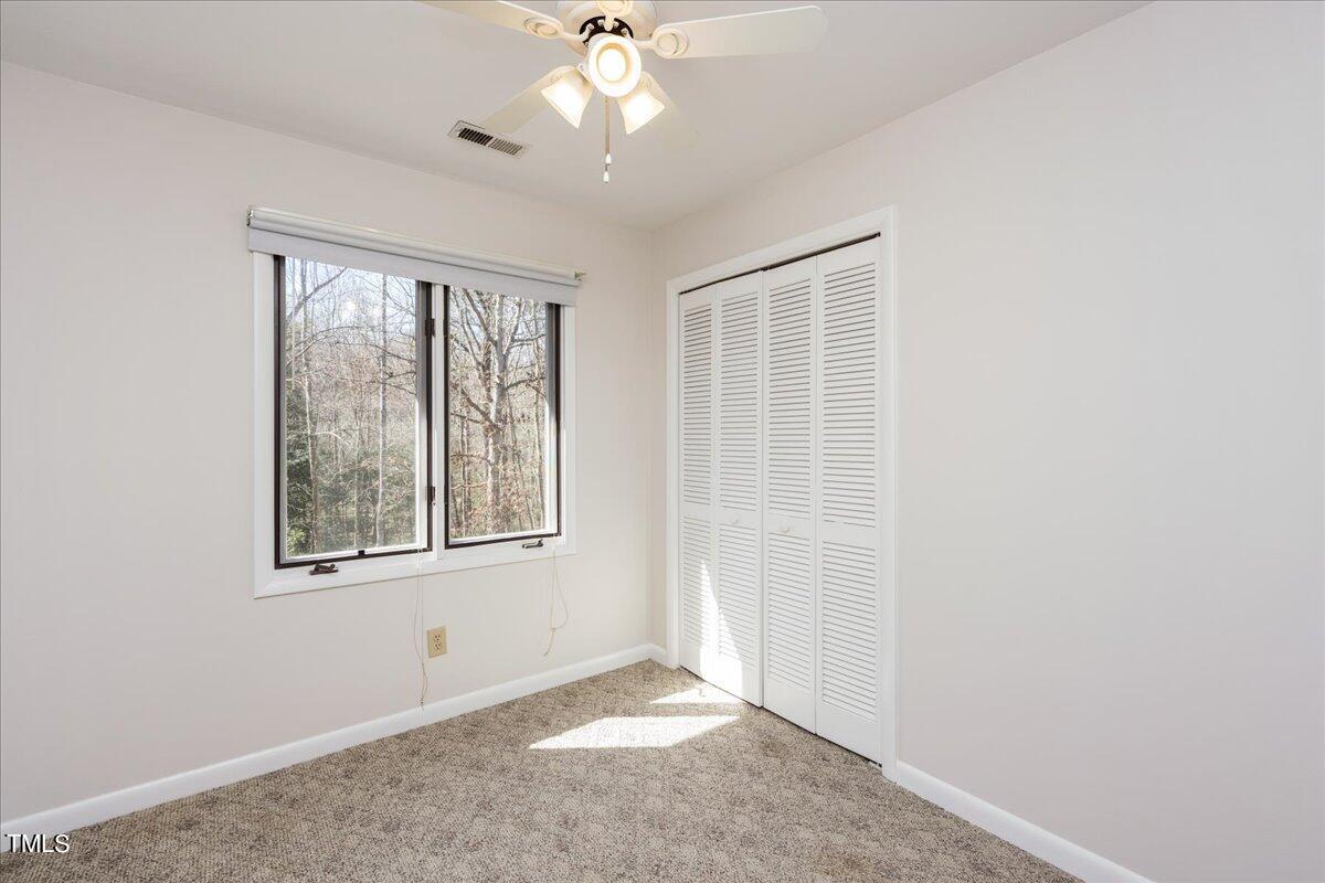 4201 Loon Lane Raleigh, NC 27616 - Photo 18 of 31 an empty room with windows and closet