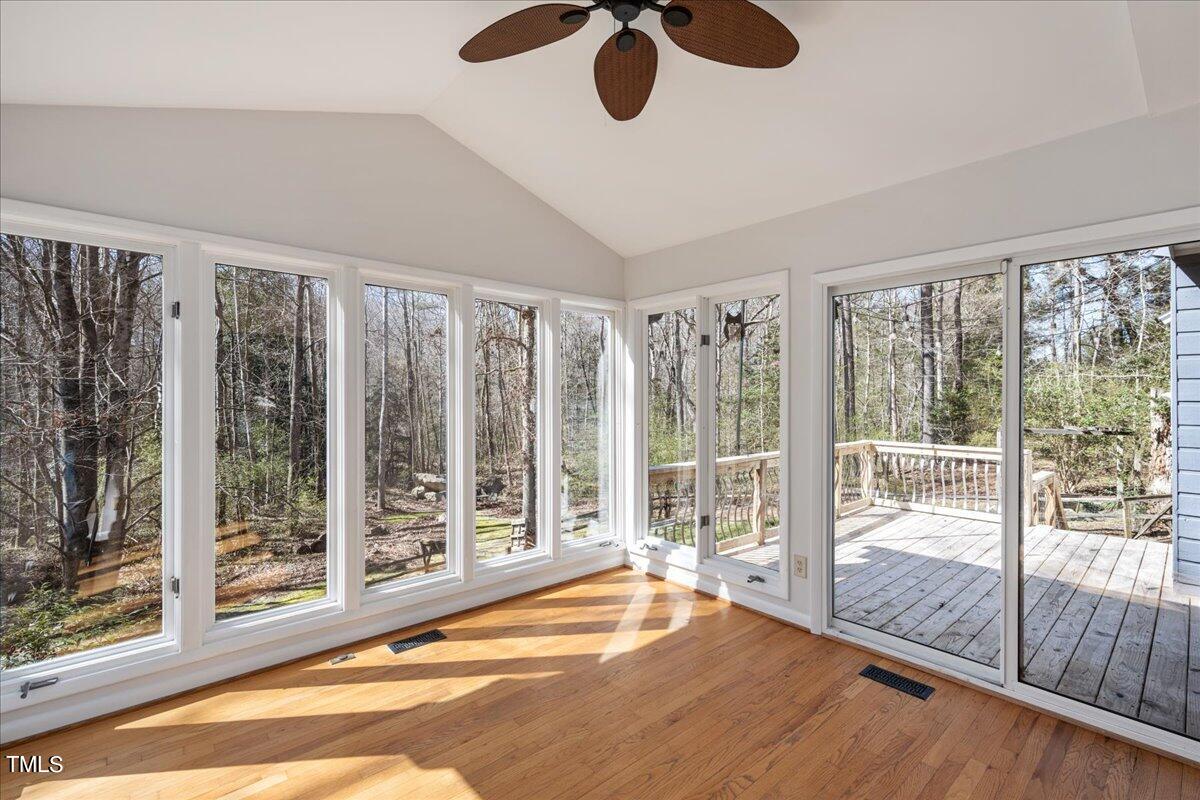 4201 Loon Lane Raleigh, NC 27616 - Photo 9 of 31 a view of an empty room with wooden floor and windows