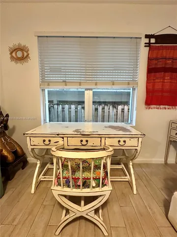 a roof deck with table and chairs
