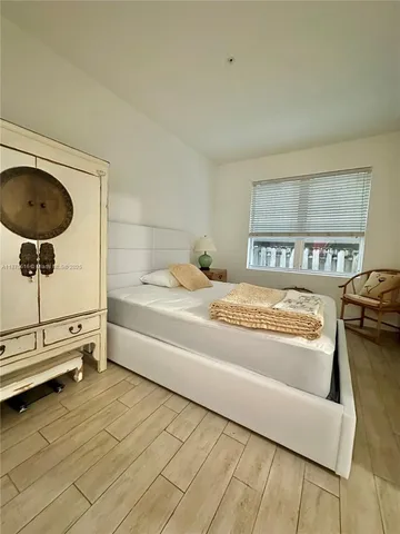a en suite bathroom with a granite countertop tub and a sink