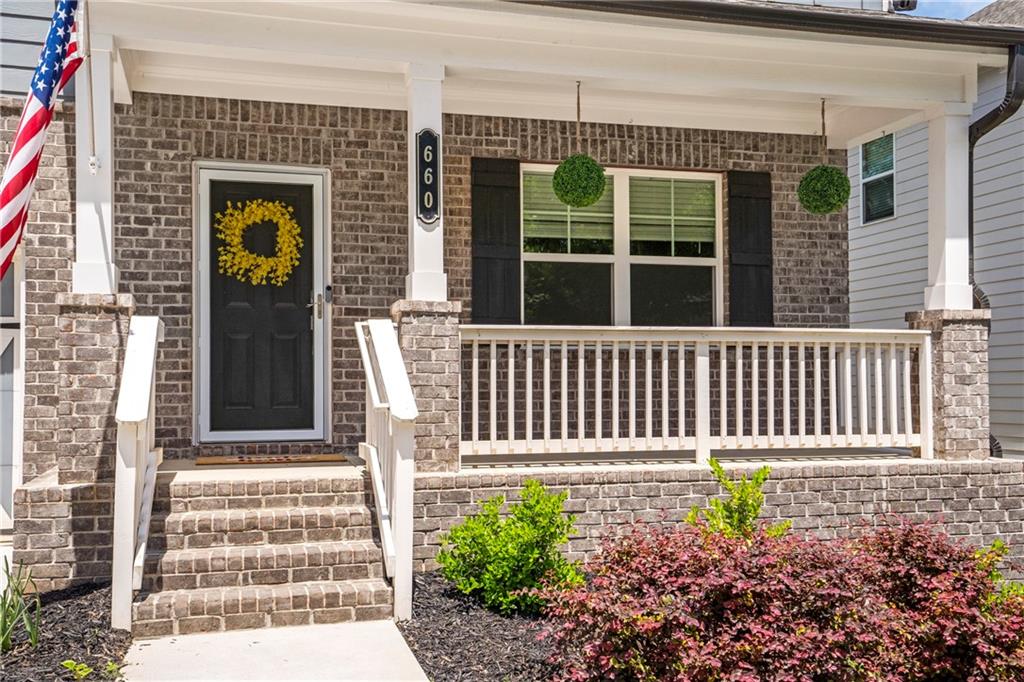 660 Groover Street Ball Ground, GA 30107 - Photo 2 of 53 a front view of a house