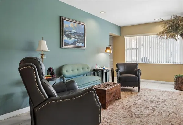 a living room with furniture and a large window