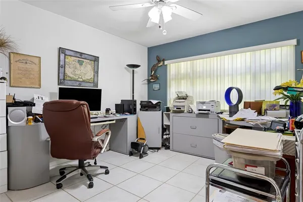 a view of a kitchen area with furniture and fan
